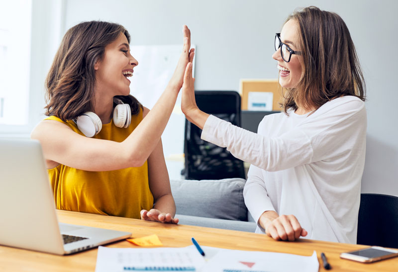 high-five-two-women-at-computer-800px.jpg